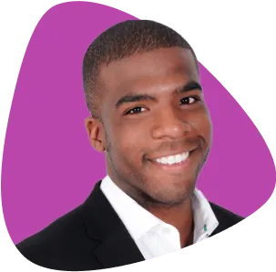 Brandon Parkes, smiling, wearing a suit.