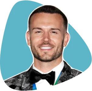 Brian Lucksinger, smiling, with a beard and wearing a black bow tie.