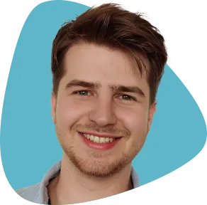 Collin Czernel, smiling, with brown hair and a beard.