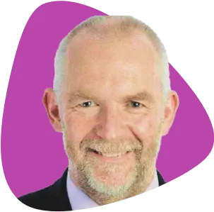 Desmond Beatty, smiling, with a beard.