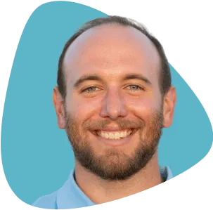 Max Frenkel, smiling, with a beard and a friendly expression.