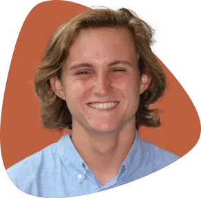 Liam Collins, smiling, with long blond hair.