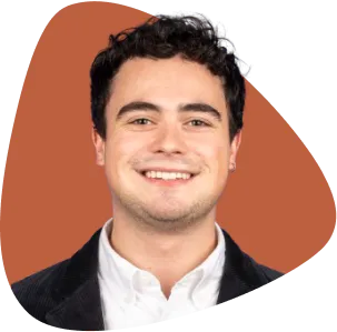 Philip Veber, smiling, with dark hair and wearing a white shirt.