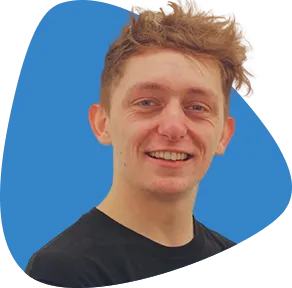 Scott Mulligan, smiling, with messy brown hair.