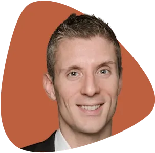 Lorenzo Thione, smiling, with short styled hair.