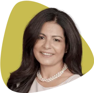 Jennifer Jeronimo, smiling, with dark hair and wearing a pearl necklace.