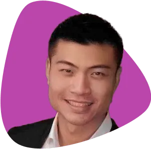 Jason VE, a man with short dark hair in a suit, smiling.